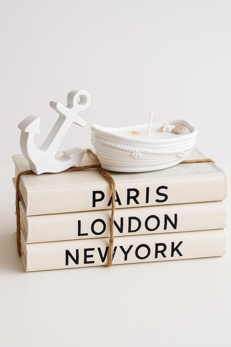 Nautical boat candle with anchor on books