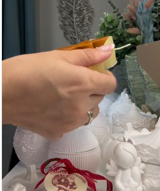 Gently releasing the gingerbread candle from its mold.