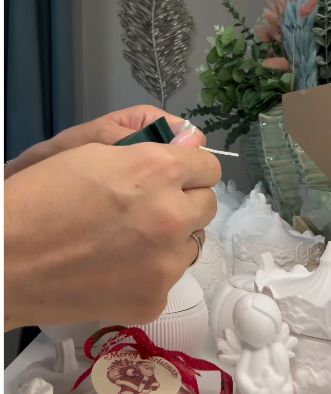 Carefully peeling back the Christmas tree mold.